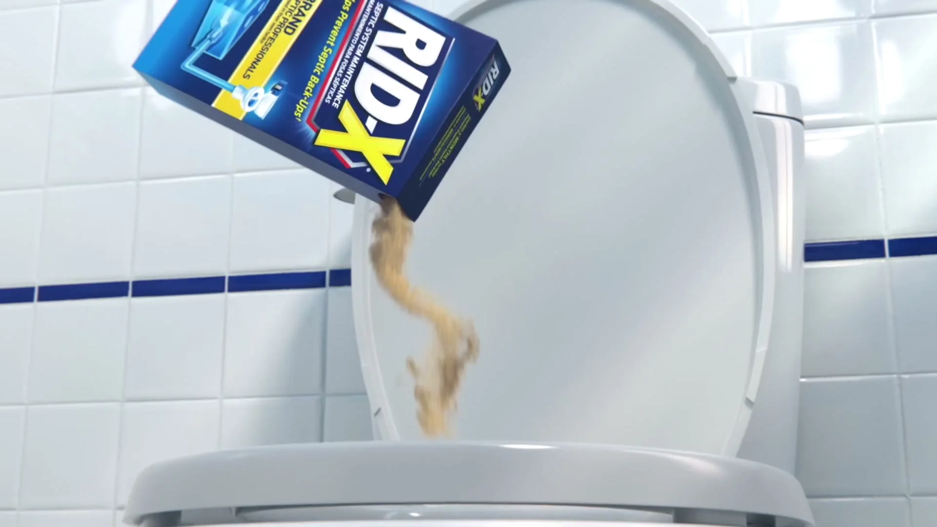 Powder poured straight into the bowl, then flushed, as the box directs. A still from a Rid-X commercial.